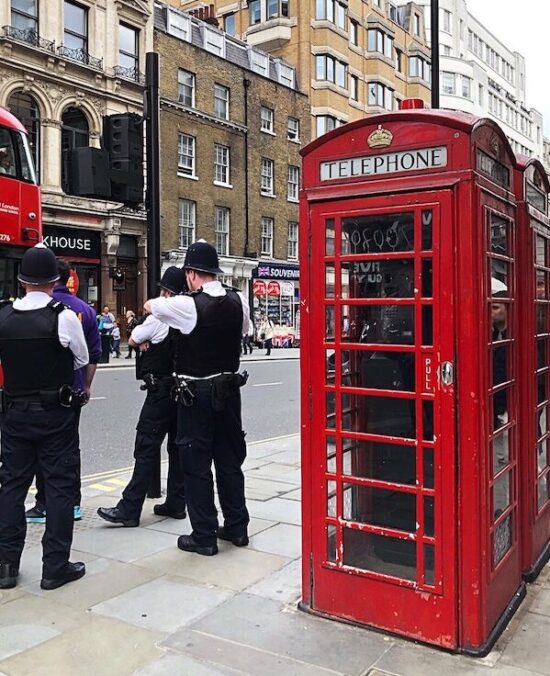 Red Phone Booth and Police at Piccadilly Circus