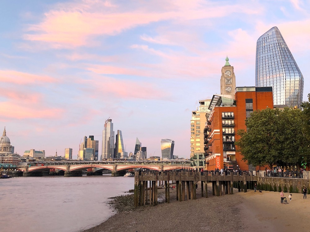 The view along the Thames River in London at sunset
