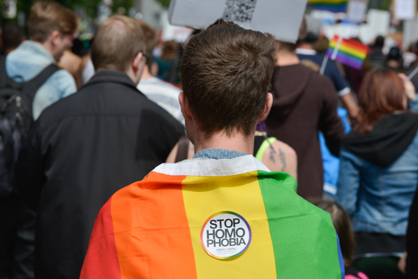 Demonstration Against Homophobia in Berlin - Man with a Rainbow Flag