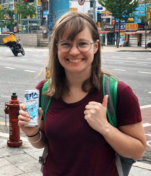 Courtney enjoying a Milkis soft drink in South Korea