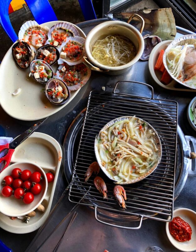 Grilled shellfish spread with tomatoes and vegetables at Noran Mahura (노란마후라) in Busan