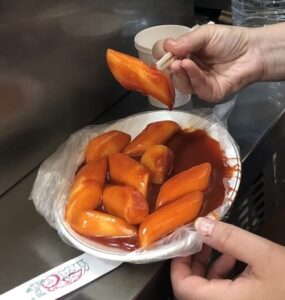 Mattie eating tteokbokki