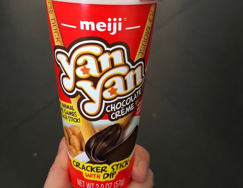 Yan Yan Chocolate Creme Snack Being Held in Hand