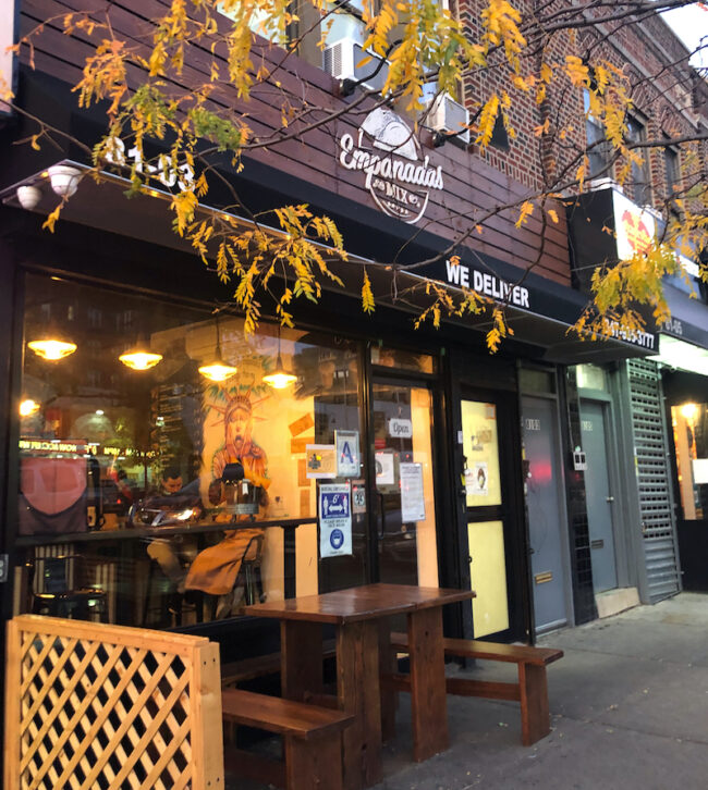 Empanadas Mix Storefront with a table outside in Jackson Heights