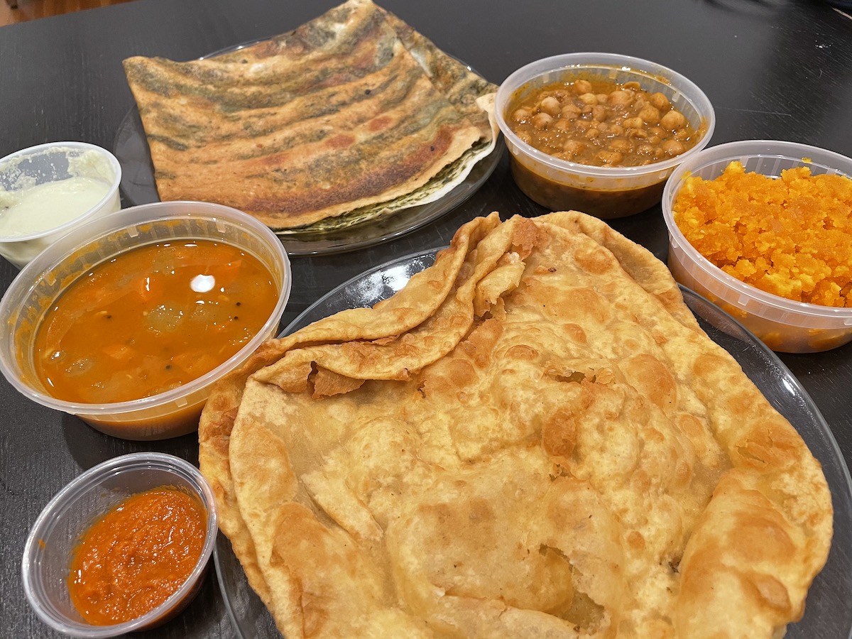 Halwa Poori and a Spinach Dosa on the table from Samudra