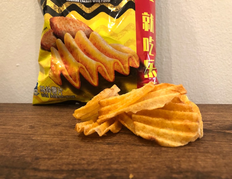 Lays Roasted Chicken Wing Flavor Wavy Potato Chips in front of the bag
