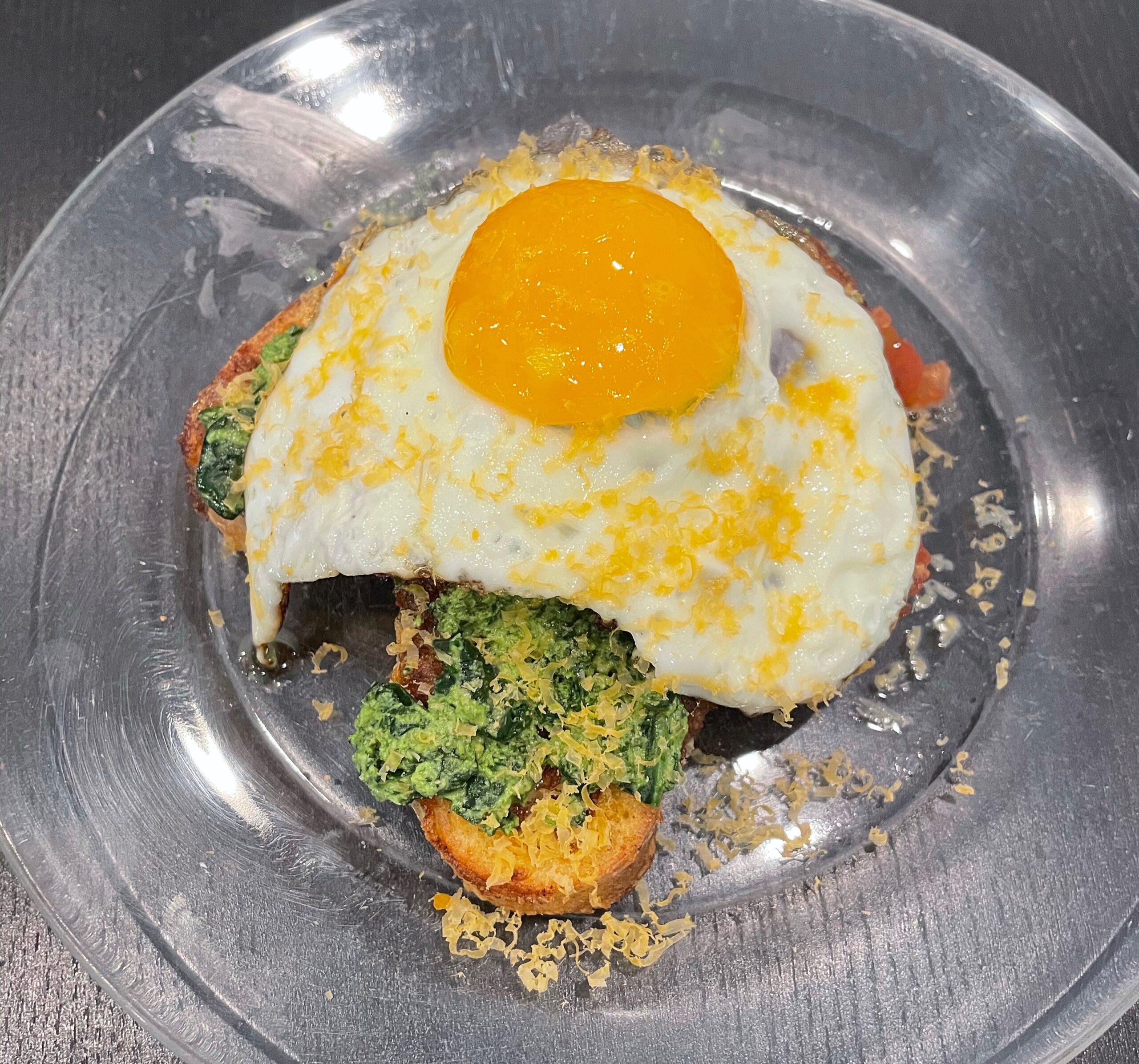 Sunnyside up egg with mimolette cheese made with ingredients from the Too Good To Go App