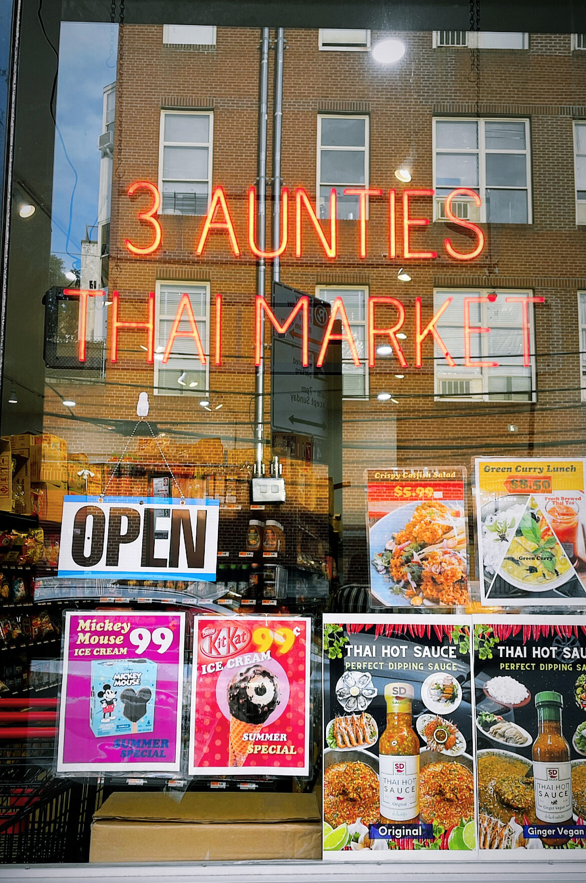 3 Aunties Thai Market Storefront with neon sign