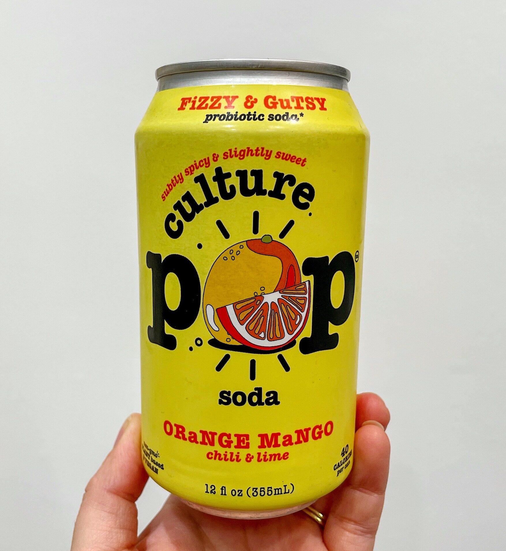A yellow can of Culture Pop Orange Mango Soda