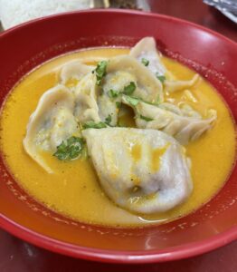 A bowl of Beef Jhol Momos from Gorkhali restaurant in Queens, NYC