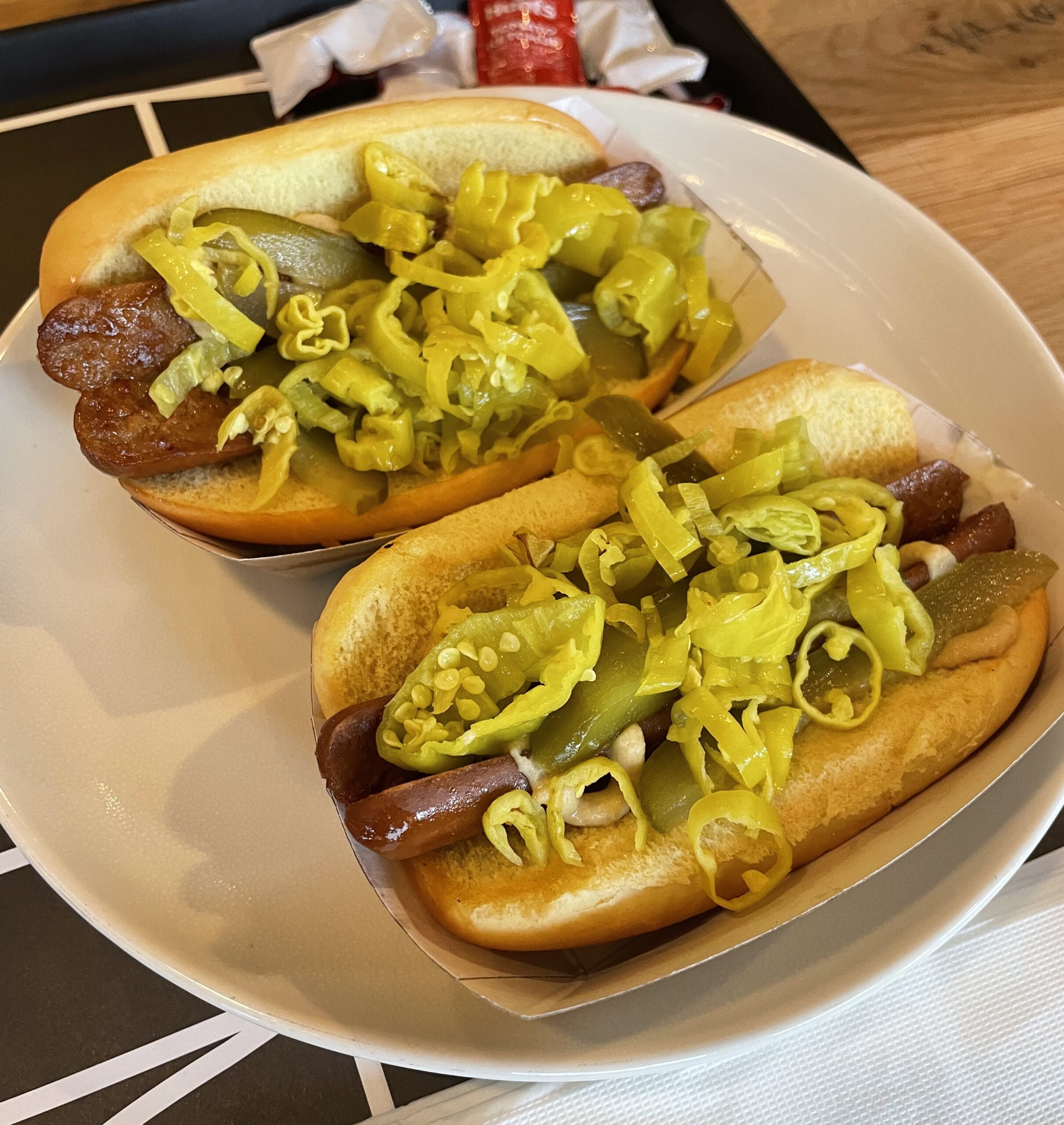 Crif Dogs Veggie Hot Dog open-faced on the bun with peppers