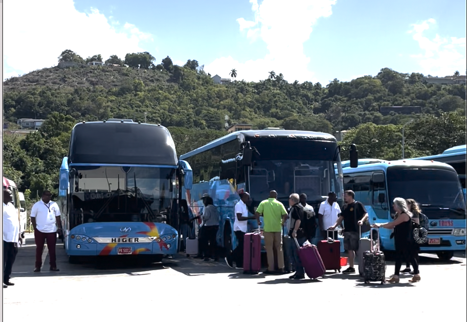 Hotel shuttle buses lined up picking up passengers outside Montego Bay International Airport